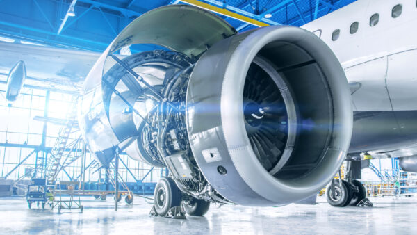 Industrial theme view. Repair and maintenance of aircraft engine on the wing of the aircraft.